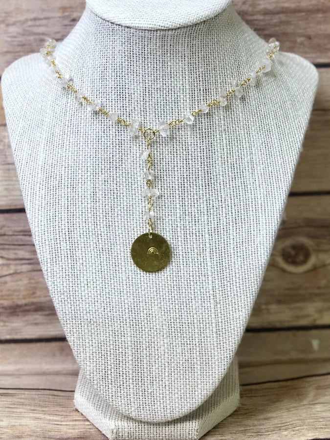 CLEAR BEAD NECKLACE WITH GOLD PLATE AND STAMPED RAINBOW DETAIL